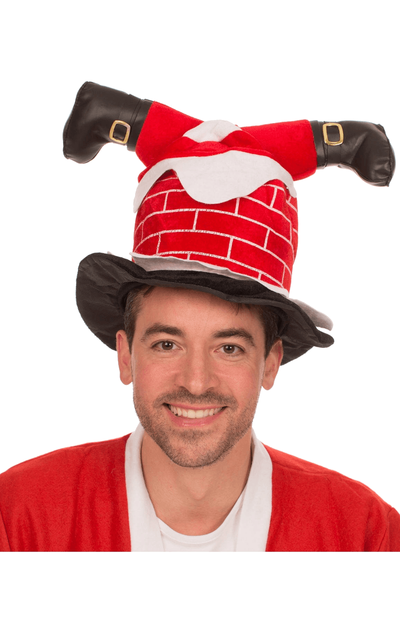 Babbo Natale adulto bloccato nel cappello del camino